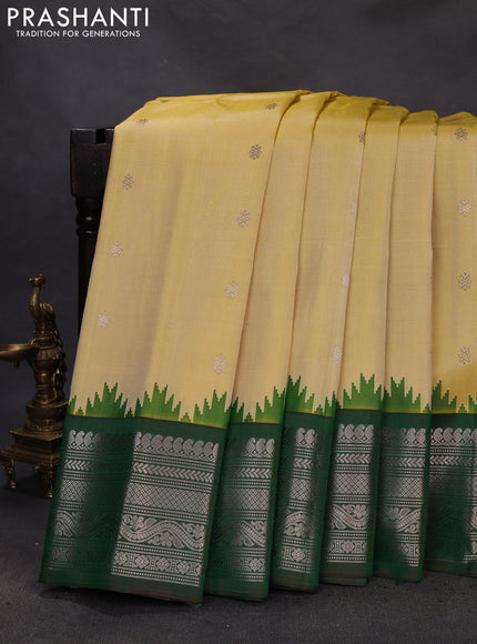 Pure gadwal silk saree pale yellow and dual shade of green with zari woven buttas and temple design zari woven border