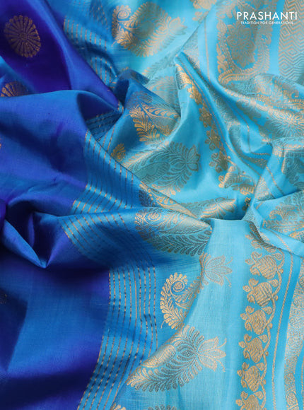 Pure gadwal silk saree blue and teal blue with zari woven buttas and temple design zari woven border