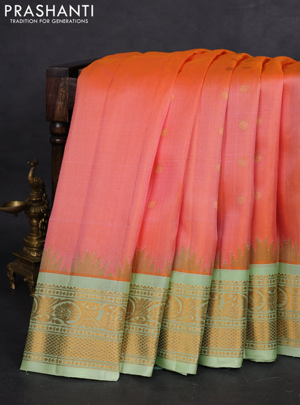 Pure gadwal silk saree dual shade of peach orange and pista green with zari woven buttas and temple design zari woven border