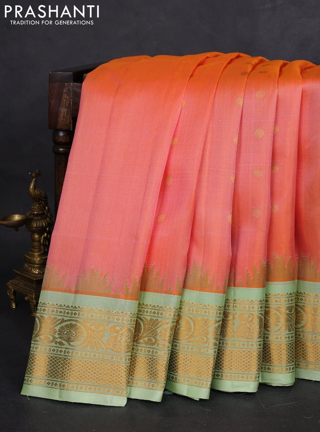 Pure gadwal silk saree dual shade of peach orange and pista green with zari woven buttas and temple design zari woven border
