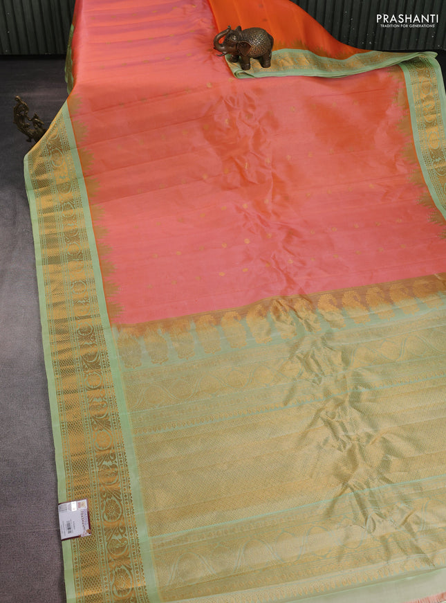 Pure gadwal silk saree dual shade of peach orange and pista green with zari woven buttas and temple design zari woven border
