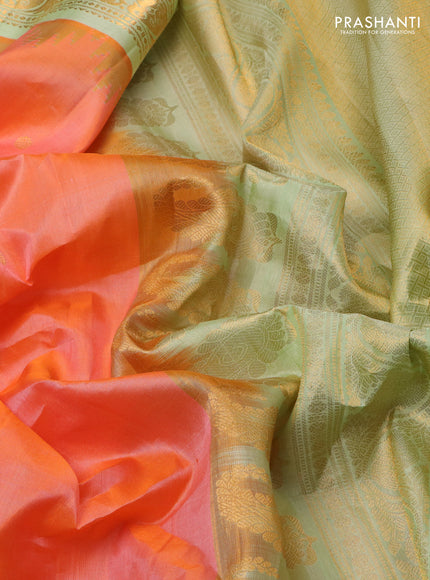 Pure gadwal silk saree dual shade of peach orange and pista green with zari woven buttas and temple design zari woven border