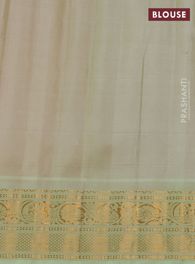 Pure gadwal silk saree dual shade of peach orange and pista green with zari woven buttas and temple design zari woven border