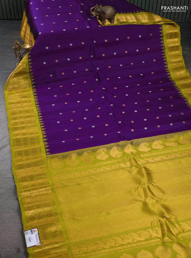 Pure gadwal silk saree purple and lime green with silver & gold zari woven buttas and temple design zari woven border