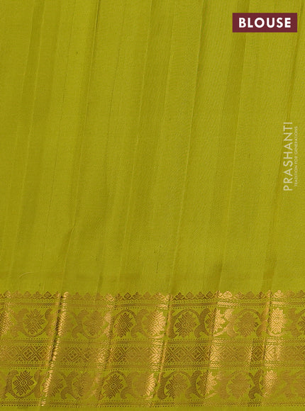 Pure gadwal silk saree purple and lime green with silver & gold zari woven buttas and temple design zari woven border