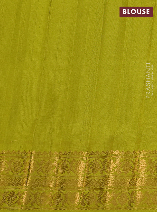 Pure gadwal silk saree purple and lime green with silver & gold zari woven buttas and temple design zari woven border