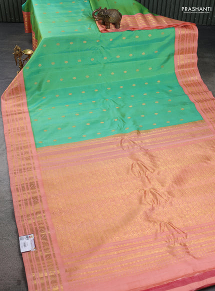 Pure gadwal silk saree teal green and peach orange with zari woven buttas and rich zari woven border