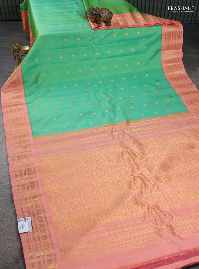 Pure gadwal silk saree teal green and peach orange with zari woven buttas and rich zari woven border