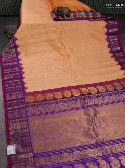 Pure gadwal silk saree pale orange and purple with zari woven buttas and temple design zari woven border