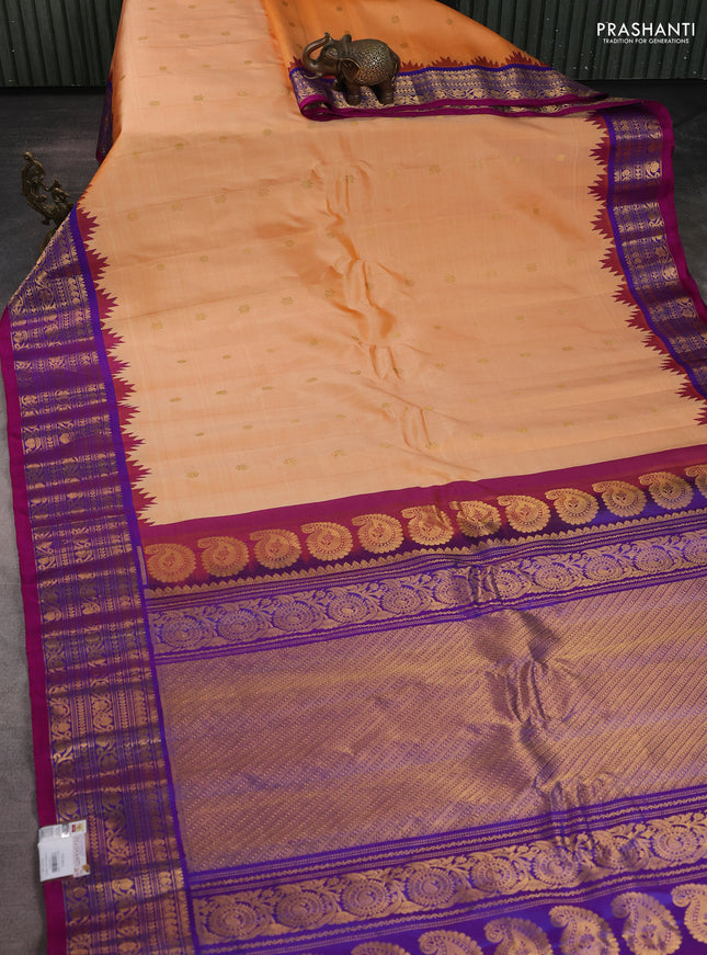 Pure gadwal silk saree pale orange and purple with zari woven buttas and temple design zari woven border