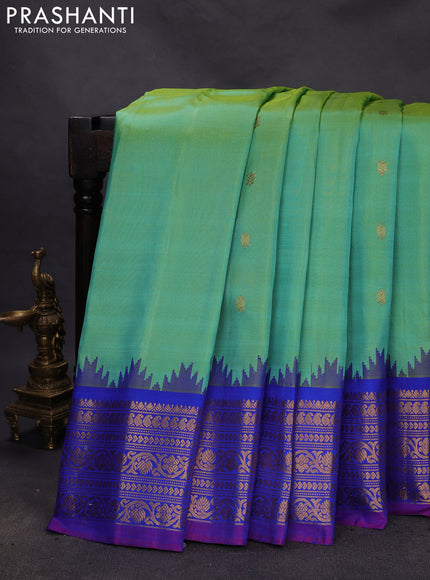 Pure gadwal silk saree dual shade of teal green and blue with zari woven buttas and temple design zari woven border