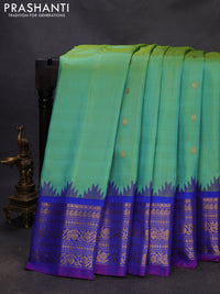 Pure gadwal silk saree dual shade of teal green and blue with zari woven buttas and temple design zari woven border