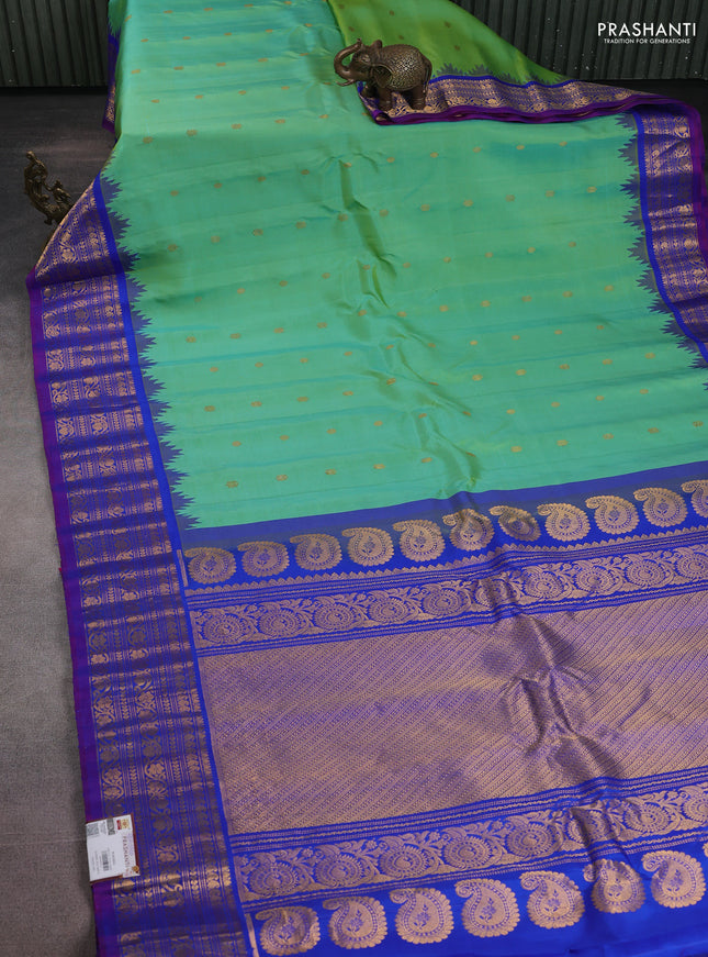 Pure gadwal silk saree dual shade of teal green and blue with zari woven buttas and temple design zari woven border
