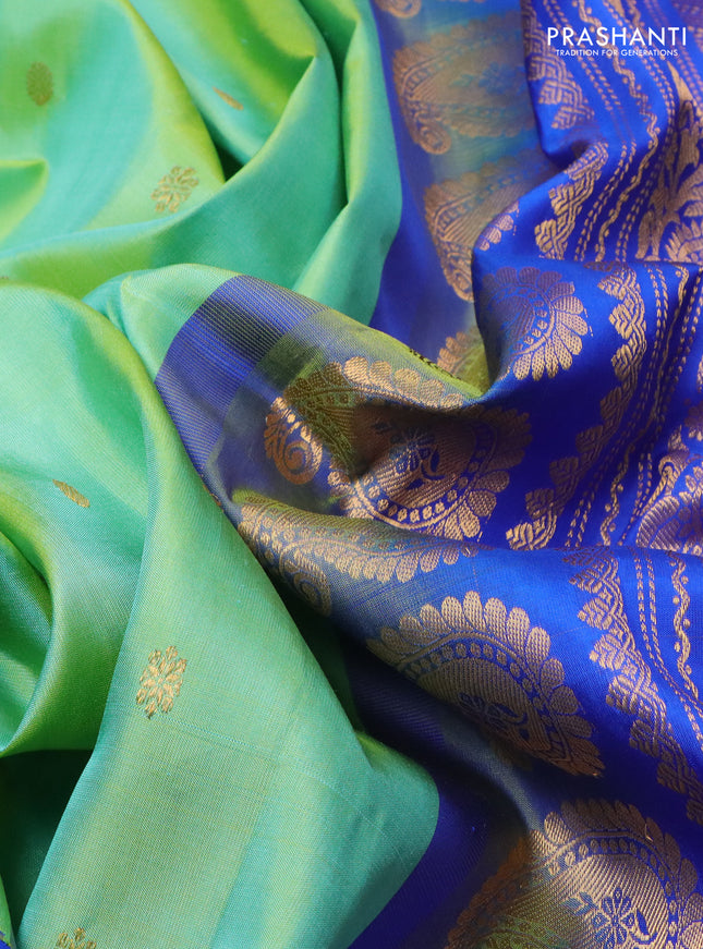 Pure gadwal silk saree dual shade of teal green and blue with zari woven buttas and temple design zari woven border