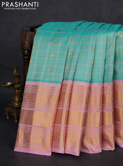 Pure gadwal silk saree teal green and mild peach pink with allover checks & zari buttas and long zari woven border