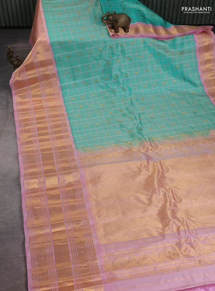 Pure gadwal silk saree teal green and mild peach pink with allover checks & zari buttas and long zari woven border
