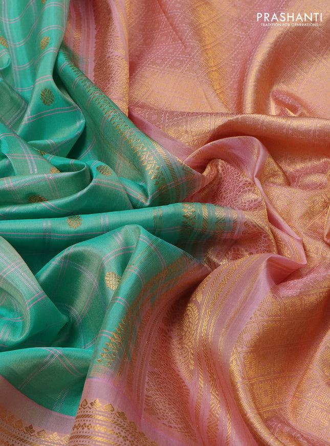 Pure gadwal silk saree teal green and mild peach pink with allover checks & zari buttas and long zari woven border