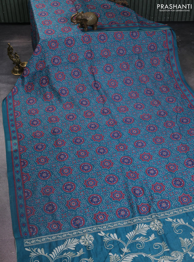 Semi chanderi saree teal green with allover prints and embroidery pallu