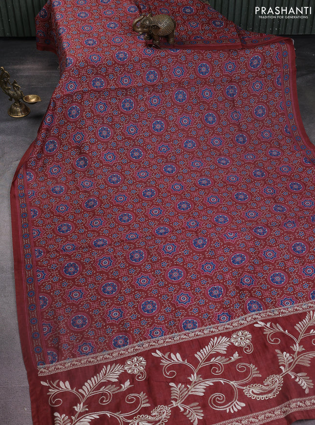 Semi chanderi saree maroon with allover prints and embroidery pallu