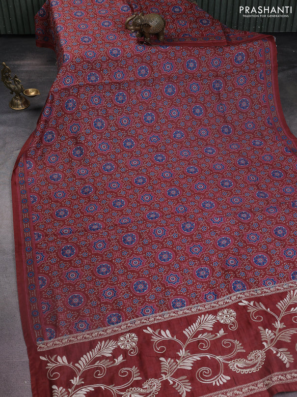 Semi chanderi saree maroon with allover prints and embroidery pallu