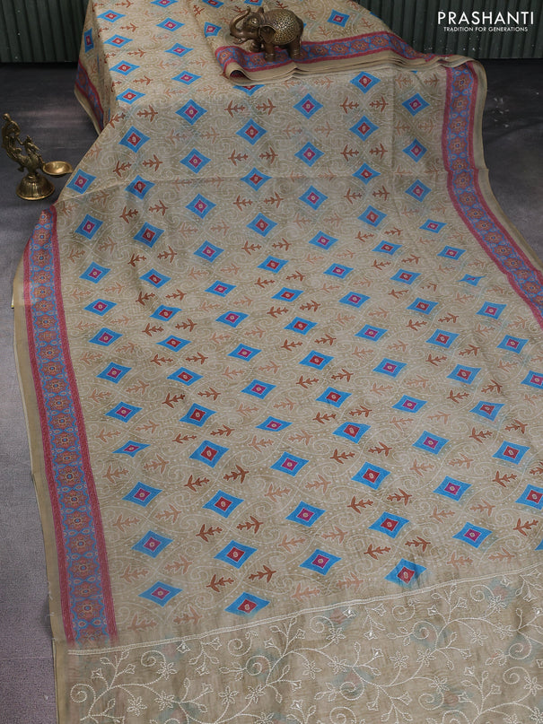 Semi chanderi saree pista green with allover prints and embroidery pallu