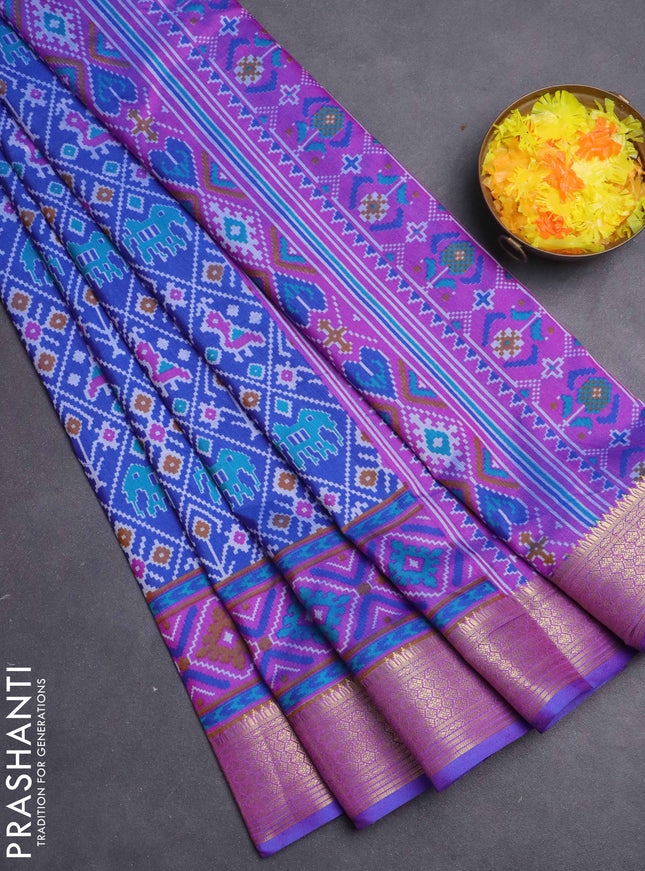 Semi tussar saree blue and purple with allover ikat prints and zari woven border