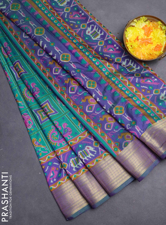 Semi tussar saree teal green and violet with allover ikat prints and zari woven border