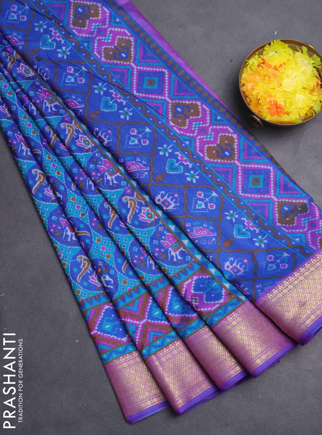 Semi tussar saree teal green and purple with allover ikat prints and zari woven border
