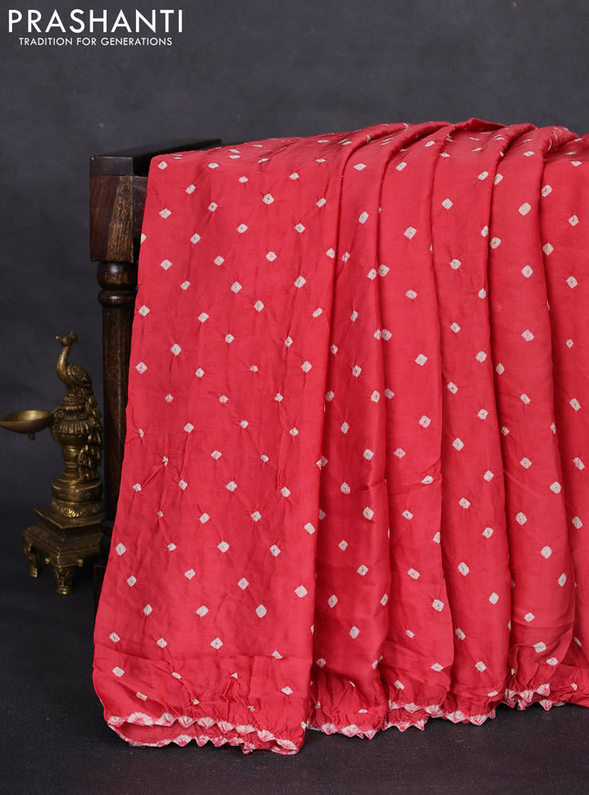 Modal silk saree peach pink and rustic orange with allover bandhani butta prints and ajrakh printed pallu & Blouse