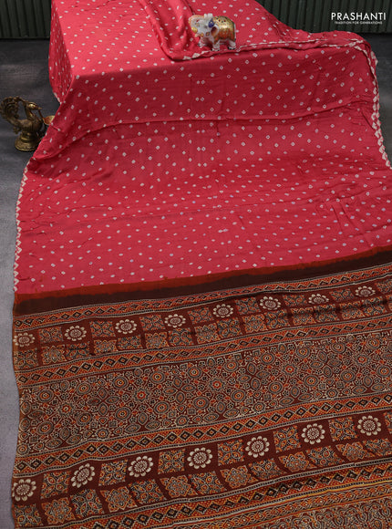 Modal silk saree peach pink and brown with allover bandhani butta prints and ajrakh printed pallu & Blouse