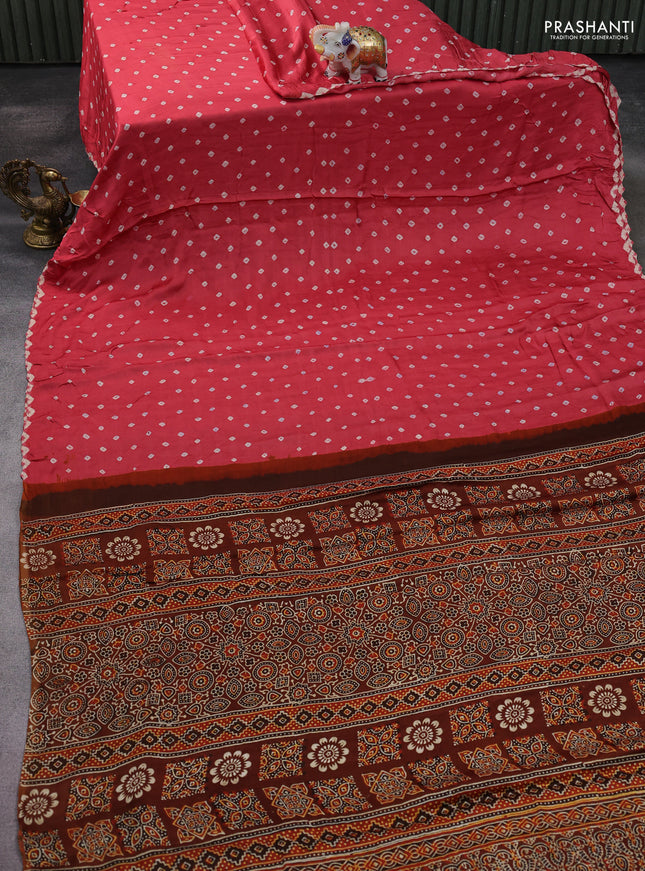 Modal silk saree peach pink and brown with allover bandhani butta prints and ajrakh printed pallu & Blouse