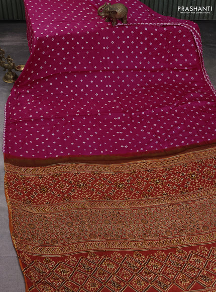 Modal silk saree pink and orange with allover bandhani butta prints and ajrakh printed pallu & Blouse