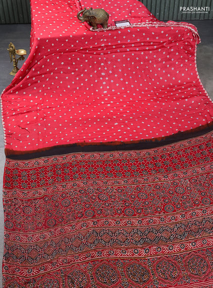Modal silk saree peach pink and red with allover bandhani butta prints and ajrakh printed pallu & Blouse