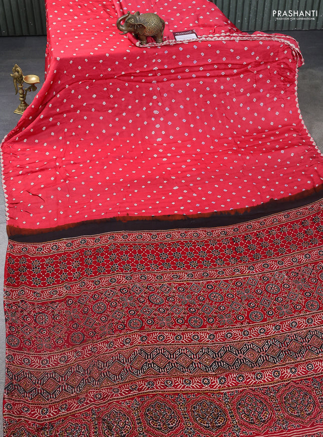 Modal silk saree peach pink and red with allover bandhani butta prints and ajrakh printed pallu & Blouse