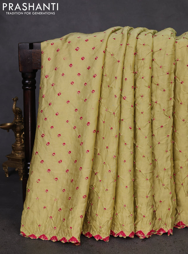 Modal silk saree pista green and black with allover bandhani butta prints and ajrakh printed pallu & Blouse