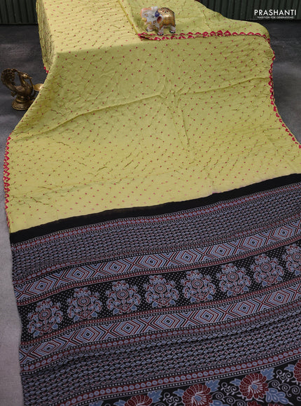 Modal silk saree pista green and black with allover bandhani butta prints and ajrakh printed pallu & Blouse