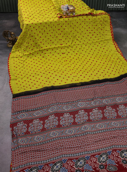 Modal silk saree lime yellow and maroon with allover bandhani butta prints and ajrakh printed pallu & Blouse