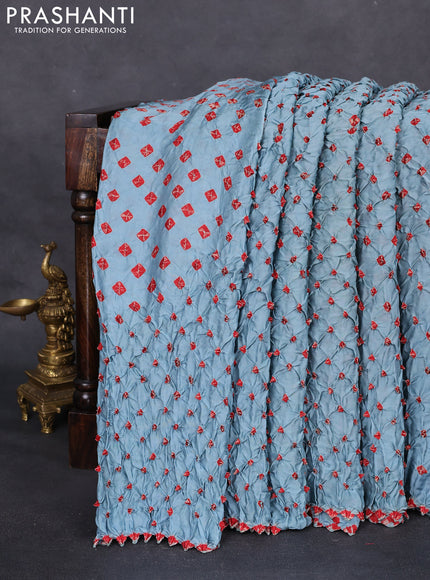 Modal silk saree pastel blue and maroon with allover bandhani butta prints and ajrakh printed pallu & Blouse