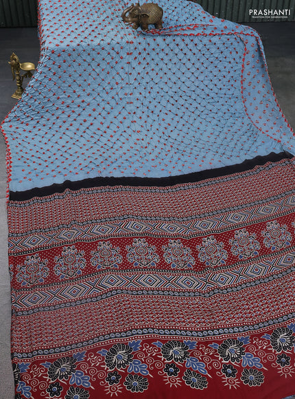 Modal silk saree pastel blue and maroon with allover bandhani butta prints and ajrakh printed pallu & Blouse