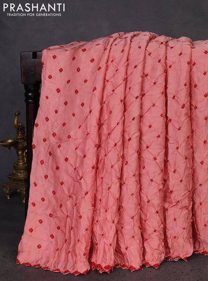 Modal silk saree peach orange and maroon with allover bandhani butta prints and ajrakh printed pallu & Blouse