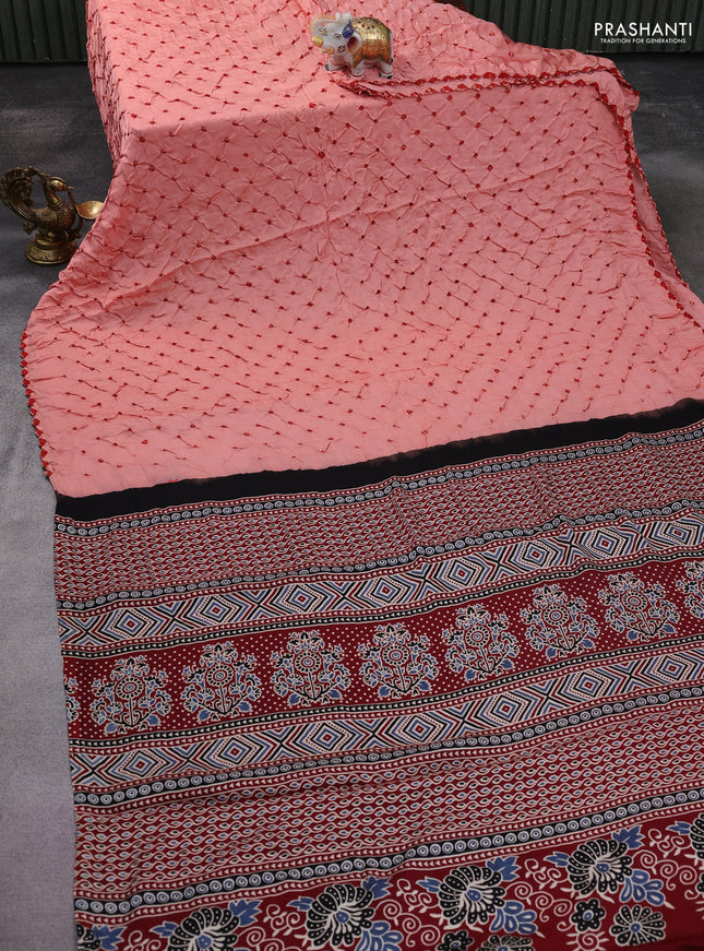 Modal silk saree peach orange and maroon with allover bandhani butta prints and ajrakh printed pallu & Blouse
