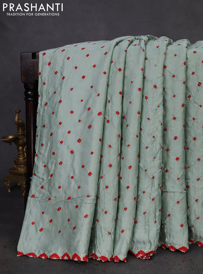 Modal silk saree pastel green and maroon with allover bandhani butta prints and ajrakh printed pallu & Blouse