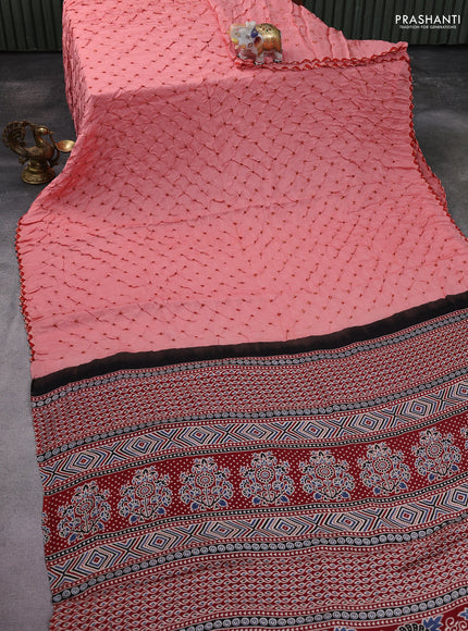 Modal silk saree peach pink and maroon with allover bandhani butta prints and ajrakh printed pallu & Blouse