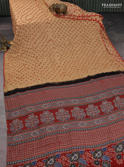 Modal silk saree sandal and maroon with allover bandhani butta prints and ajrakh printed pallu & Blouse