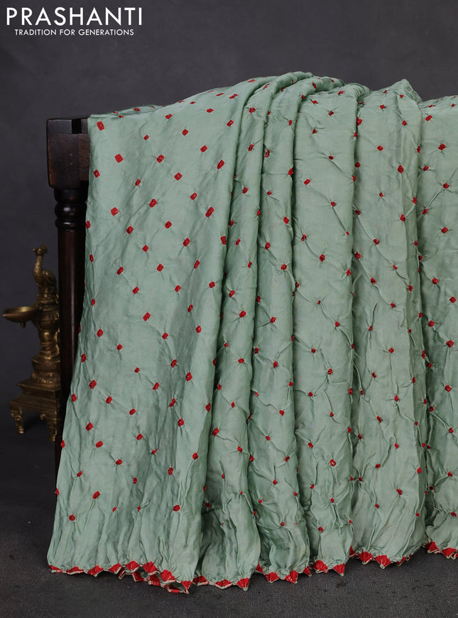 Modal silk saree pastel green and maroon with allover bandhani butta prints and ajrakh printed pallu & Blouse