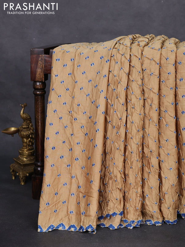 Modal silk saree sandal and peacock blue with allover bandhani butta prints and ajrakh printed pallu & Blouse