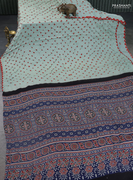 Modal silk saree pastel green and peacock blue with allover bandhani butta prints and ajrakh printed pallu & Blouse