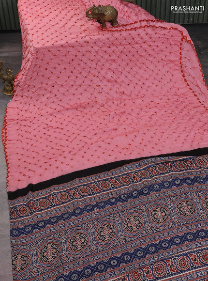 Modal silk saree peach pink and peacock blue with allover bandhani butta prints and ajrakh printed pallu & Blouse