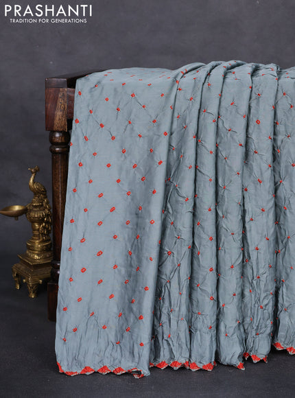 Modal silk saree pastel blue and black with allover bandhani butta prints and ajrakh printed pallu & Blouse