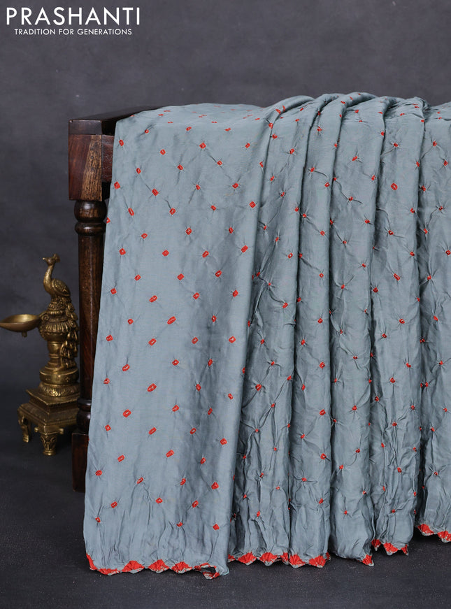 Modal silk saree pastel blue and black with allover bandhani butta prints and ajrakh printed pallu & Blouse